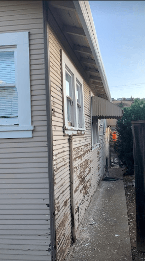 Exterior wood siding after restoration — clean two-coat finish