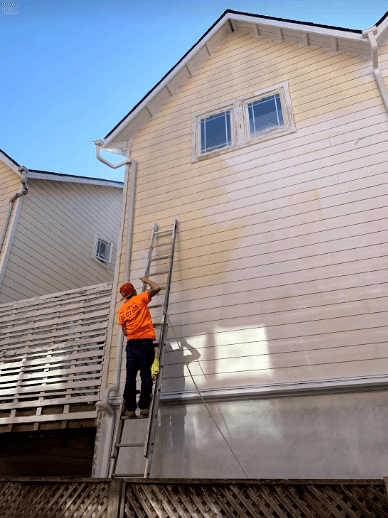Professional exterior painting on residential siding